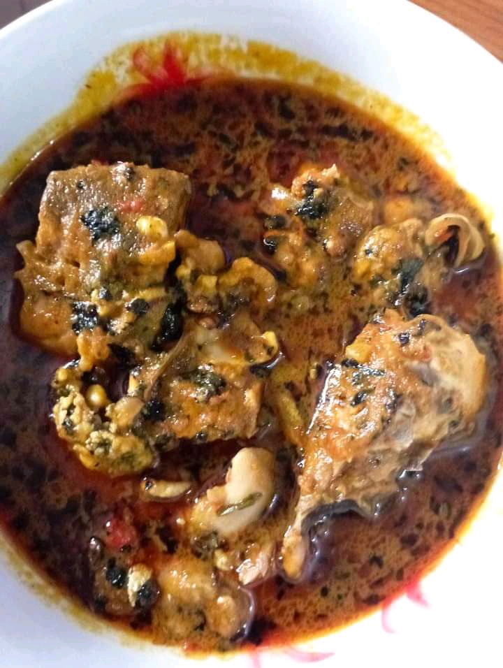Freshly cooked Nigerian banga soup in a serving bowl