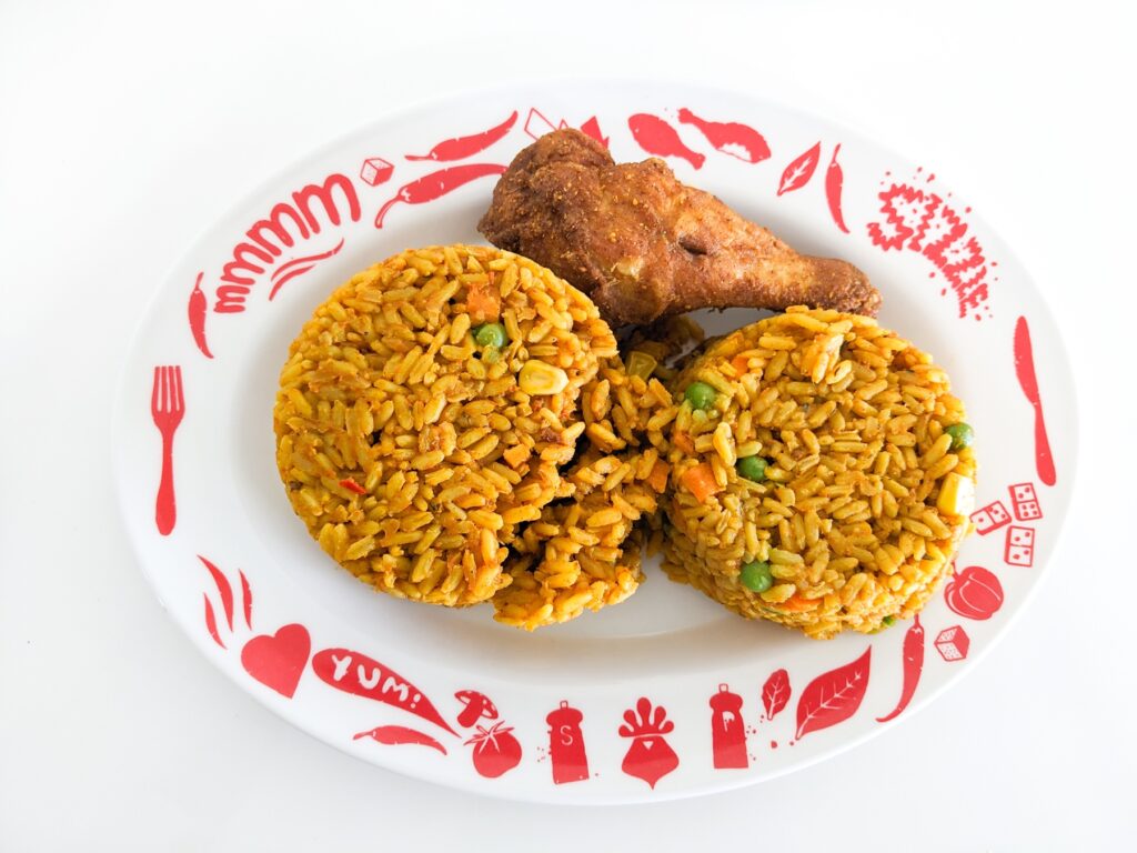 Plate of Nigerian jollof rice served with chicken