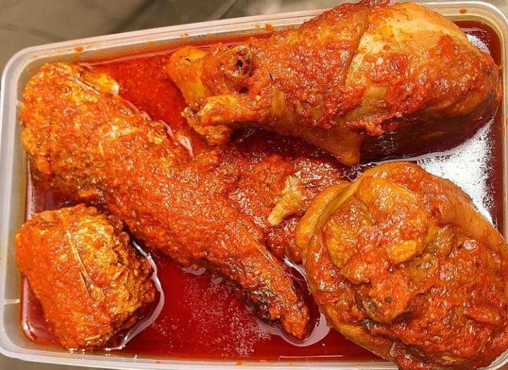 Nigerian tomato stew with chicken and fish
